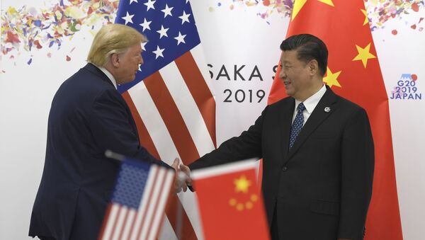 Donald Trump y Xi Jinping durante la cumbre del G20 en Osaka  - Sputnik Mundo