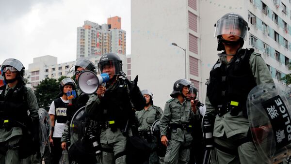 La policía en las protestas de Hong Kong - Sputnik Mundo