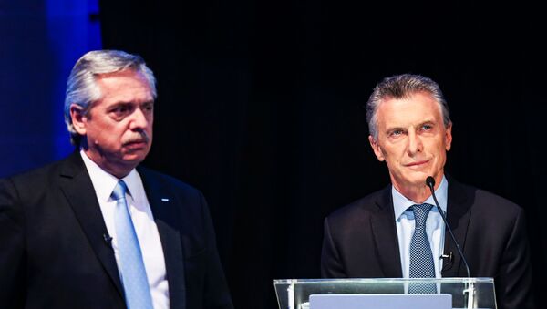 Alberto Fernández y Mauricio Macri durante el primer debate presidencial de 2019 en Argentina - Sputnik Mundo