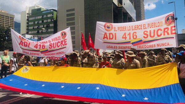 Miembros de ADI 416 manifestándose en Caracas a favor de Evo Morales y contra el golpe de estado en Bolivia - Sputnik Mundo