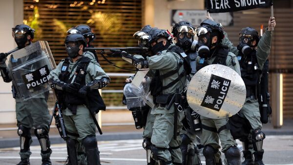 La Policía de Hong Kong durante las manifestaciones - Sputnik Mundo