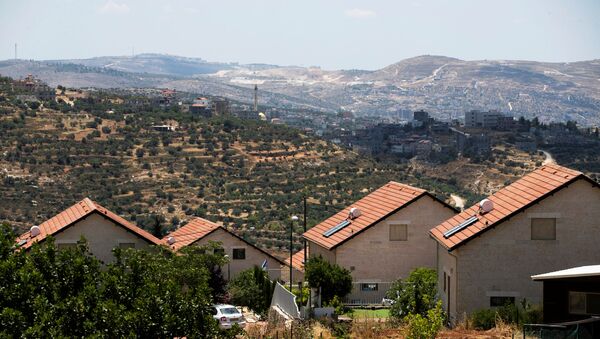Un asentamiento israelí en la Cisjordania ocupada - Sputnik Mundo