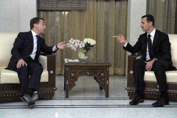 Los presidentes de Rusia y Siria Dmitri Medvedev y Bashar Asad. Archivo - Sputnik Mundo