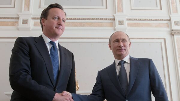 Primer ministro del Reino Unido, David Cameron, y presidente de Rusia, Vladímir Putin - Sputnik Mundo
