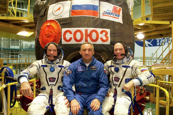 Steven Swanson, Alexandr Skvortsov  y Oleg Artemiev - Sputnik Mundo