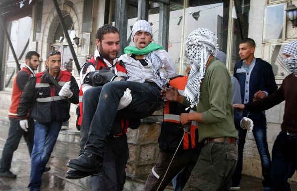 Decenas de palestinos heridos en disturbios en Cisjordania - Sputnik Mundo